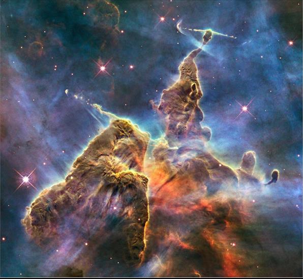 kosmos - Efekt 20-godz. pracy teleskopu Hubbla -rosnąca góra pyłu w Mgławicy Carina.jpg